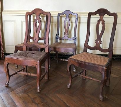 A suite of four chairs in stained fruitwood,...