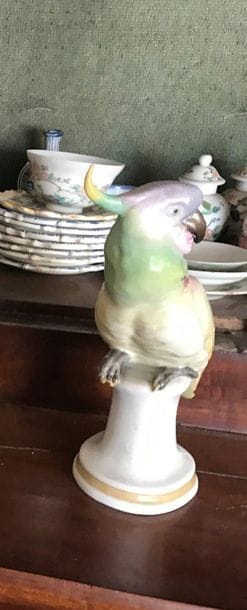 Pair of polychrome porcelain statuettes representing...