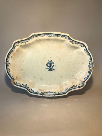 Oval earthenware dish with contoured rim...