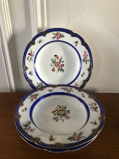Three porcelain plates decorated with polychrome...