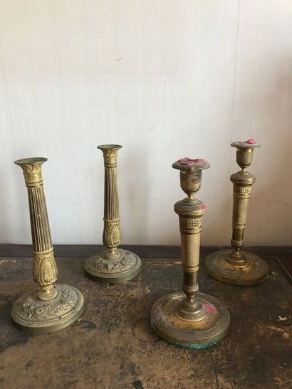 Pair of golden brass torches, the shaft gadrooned....