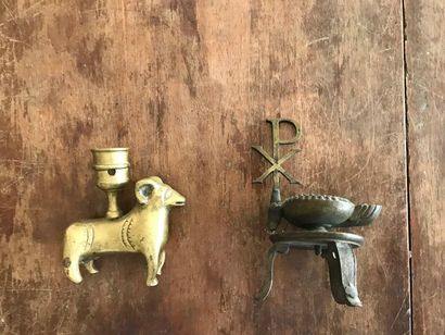 Trinkets: a bronze torch showing a ram (pierced)...