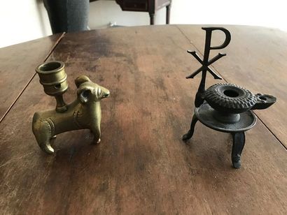 Trinkets: a bronze torch showing a ram (pierced)...