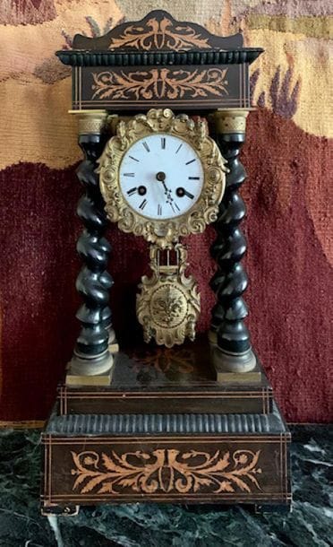 Wooden portico clock inlaid with bird's heads...