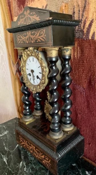 Wooden portico clock inlaid with bird's heads...