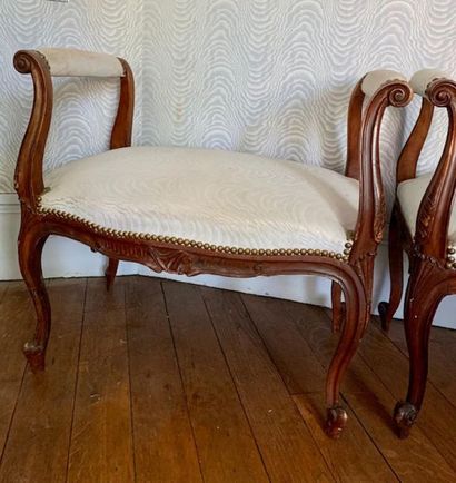 Pair of small benches in natural wood molded...