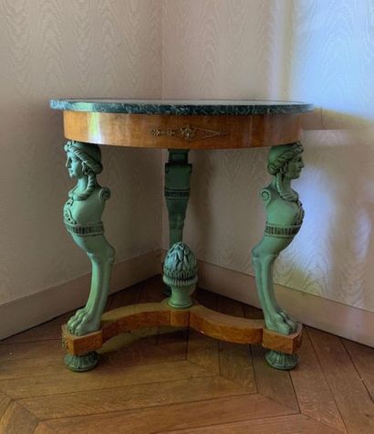 Elm burr veneer pedestal table rests on three...