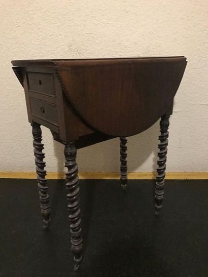 Rosewood bedside table with flaps. Opens...