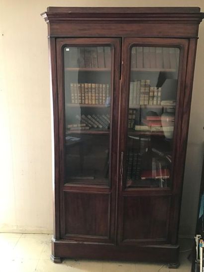 Mahogany and mahogany veneer bookcase. Opens...