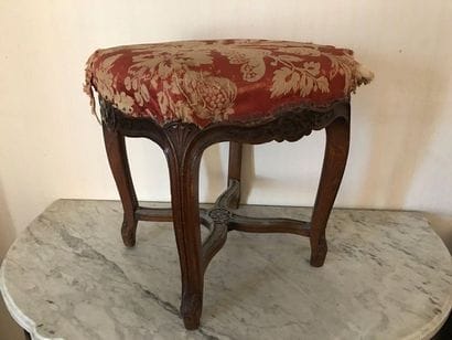 Stool in natural wood molded and carved with...