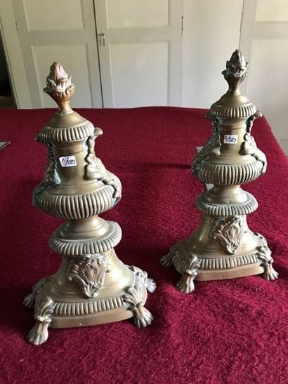 Pair of bronze andirons featuring cassolettes...