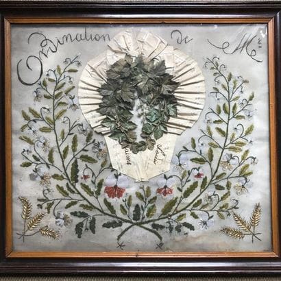 Embroidery composed of an armband surrounding...
