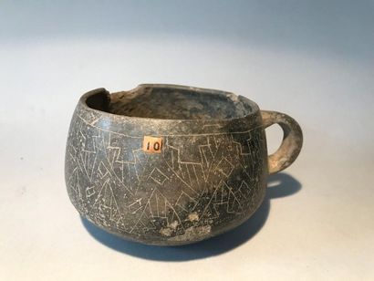 Vase with a handle and decoration of engraved...