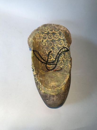 Carved wooden mask, coloured beads and cowries,...