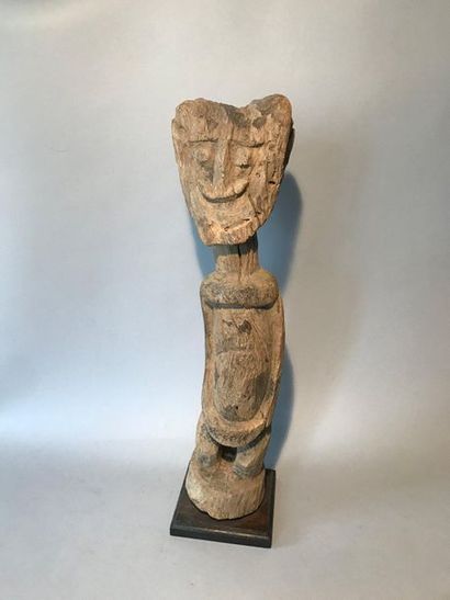 Carved wooden statue representing an anthropomorphic...