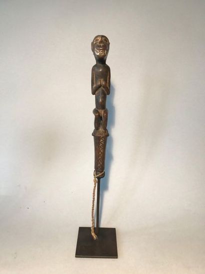 Carved wooden music hammer representing a...