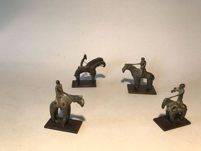 Set of four bronze figurines representing...