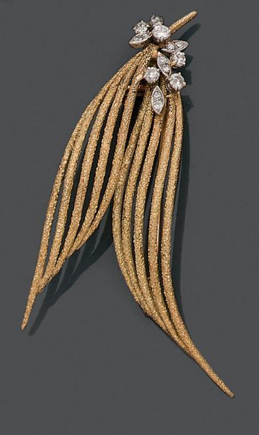 Broche en or jaune 18K (750), figurant deux...