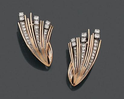 Paire de clips d'oreille, en platine et or...