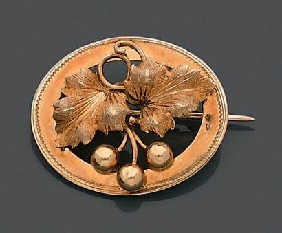Broche ovale en or jaune 18K (750), repercée...