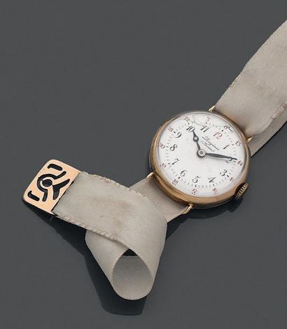 Montre en or jaune 18K (750) de forme ronde,...
