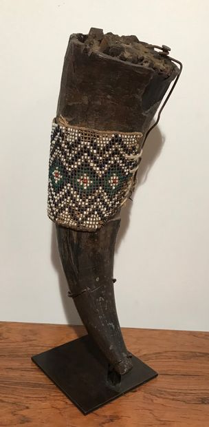 Fetish horn decorated with damaged beading...