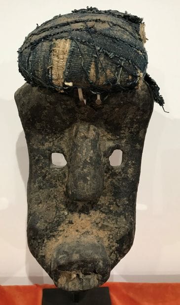 Carved wooden mask with sacrificial patina...