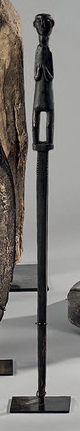 Stick topped with a character. Wood. Choco...