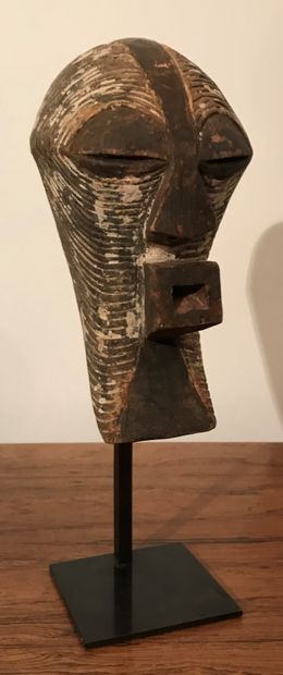 Kifwebe mask. Drink. 
Songye People. Democratic...