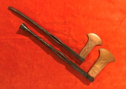Two wrought iron and copper hatchets. 
Democratic...