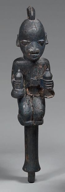 Oshe shango in wood with black patina representing...