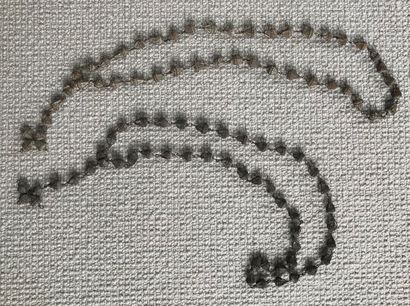 Two rosaries in exotic fruit shells. 
Probably...