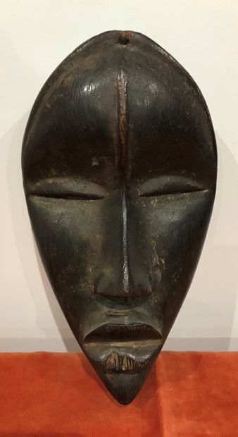 Almond mask with sharp eyes. Hard wood with...