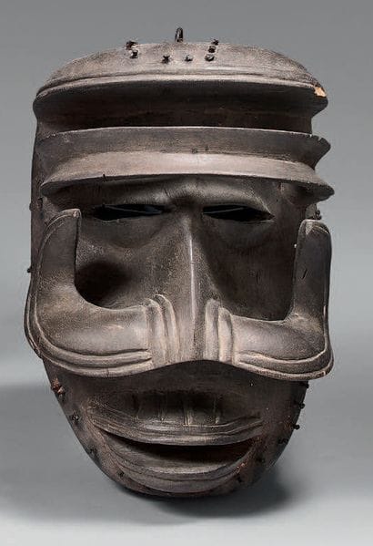 Wooden mask carved with warthog teeth. 
Bete...