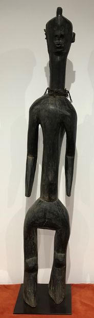 Statue of a standing figure with arms detached...