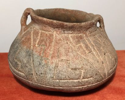 Small incised terracotta pot with geometric...