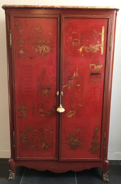 A lacquered wood cabinet, the two doors and...