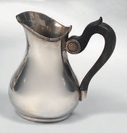 A silver milk jug, baluster shape, with a...