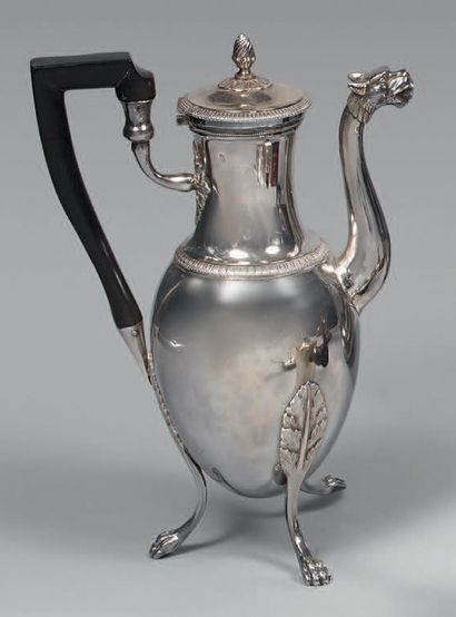 A silver ovoid coffee pot, standing on three...