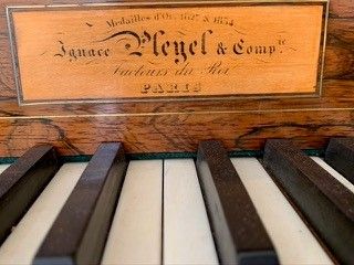 Mahogany and mahogany veneer piano, the flap...