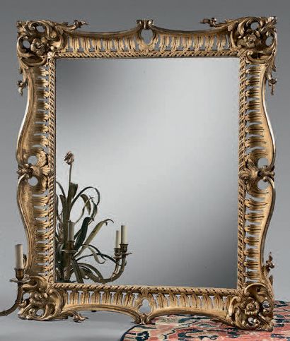 Mirror with gilded wood frame, openwork of...