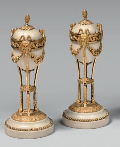 A pair of white marble and gilt bronze cassolettes...