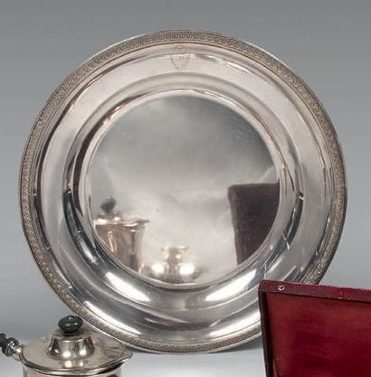 Round silver dish, the edge with palmettes...
