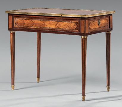 A veneered writing table inlaid with Greek...