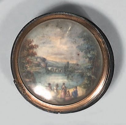 A round box made of pressed wood in imitation...