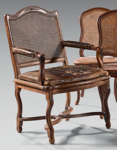 Armchair in natural wood moulded and carved...
