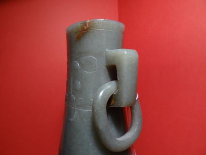 CHINE - XXe siècle.
A celadon and rust nephrite...