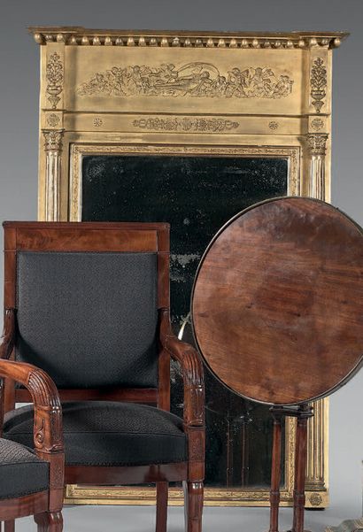 Mirror with gilded wood frame, the pediment...