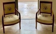 Pair of walnut armchairs, the back slightly...
