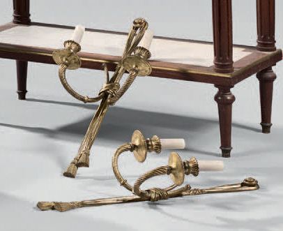 A pair of bronze wall sconces with two lights,...